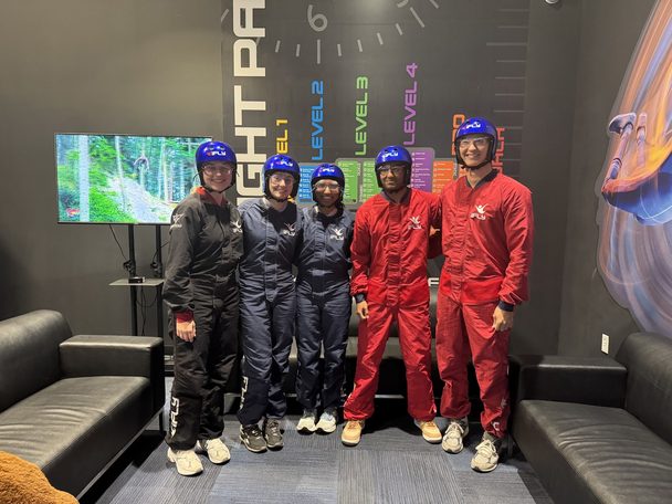 Lab members at an indoor skydiving outing.