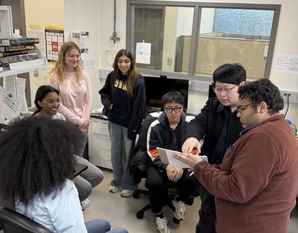 Lab members at a group meeting.