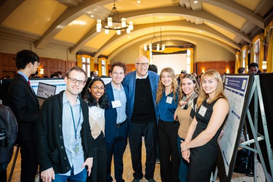 Lab members at a poster symposium.